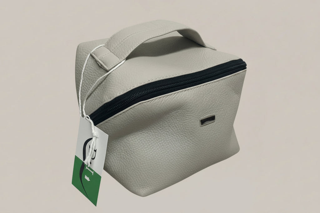 Gray pouch with a black zipper on a light gray background
