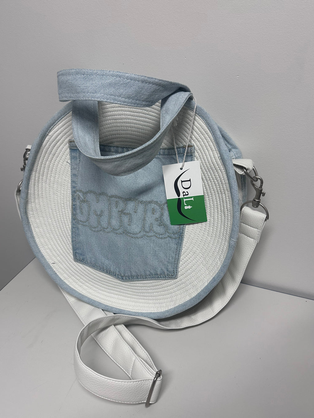 Handmade denim bag with a strap and Dali logo tag