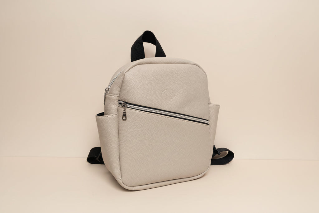 Light Grey backpack with a brand logo on a white background